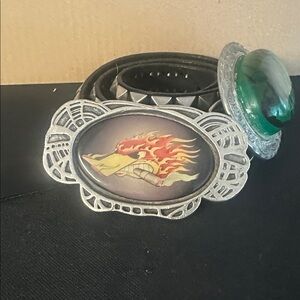 Two belt buckles and a studded belt